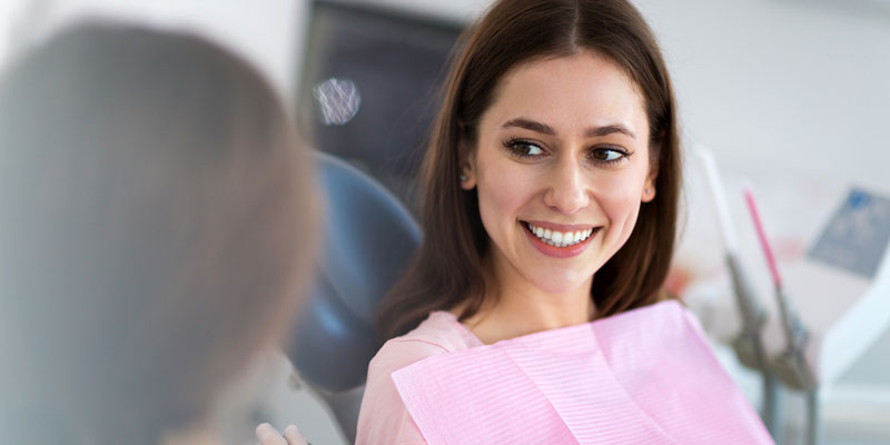 girl smiling in dental office chair